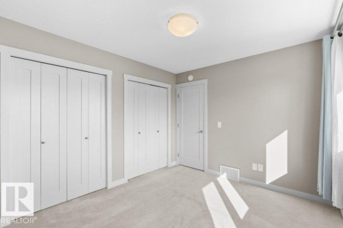 Wall-to-wall carpeting with light gray paint throughout - 1523 168 Street Sw, Edmonton, AB 