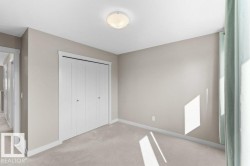 Recessed ceiling lighting, light neutral wall paint, bi-fold closet doors, wall-to-wall carpeting, and white trim - 