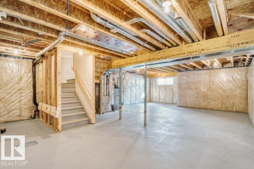 Unfinished basement with exposed wood joists, ductwork, and insulation - 1523 168 Street Sw, Edmonton, AB 