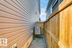 Exterior wall with tan horizontal siding - 