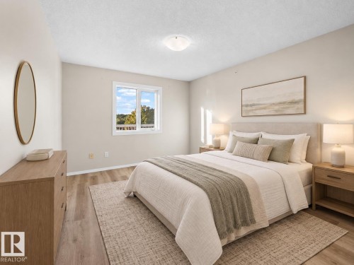 Recessed lighting, light-toned walls, and wood-finish flooring - #408 10610 76 St Nw, Edmonton, AB 