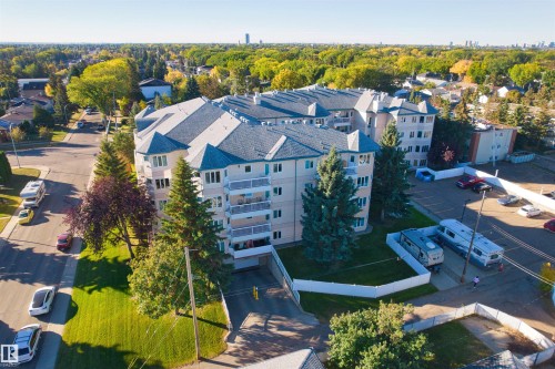 Multi-story building featuring a pitched roof and multiple balconies - #408 10610 76 St Nw, Edmonton, AB 
