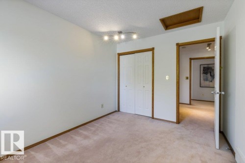 Plush carpeting and white wall finishes - 507 Burton Close Nw, Edmonton, AB 