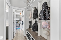 Built-in storage bench with wood-finish top and lower shelving - 