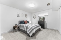 Neutral wall finishes, recessed lighting, window with blinds, and light-toned carpet flooring - 