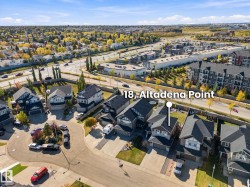 Residential property featuring a two-story design with an attached garage, situated on a cul-de-sac - 