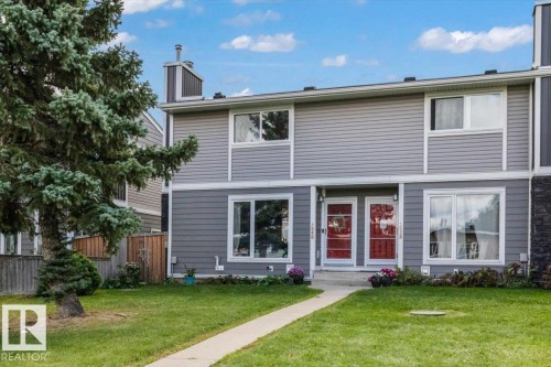 Gray siding exterior with white trim - 1040 Lakewood Rd N Nw, Edmonton, AB 