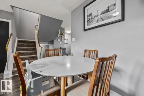 Wood-finish flooring with a neutral wall color - 1040 Lakewood Rd N Nw, Edmonton, AB 