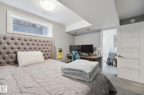Recessed lighting, flush-mount ceiling light, window well, four-panel interior door, and light gray wall paint - 324 Ascott Crescent, Sherwood Park, AB 