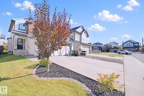 Two-story residence featuring a front entry, concrete driveway, and attached two-car garage - 324 Ascott Crescent, Sherwood Park, AB 