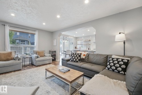 Recessed ceiling lighting, wood-finish flooring, and an arched entryway - 324 Ascott Crescent, Sherwood Park, AB 