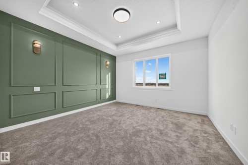 Accent wall with decorative molding and wall sconces - 13024 186 Avene Nw, Edmonton, AB 