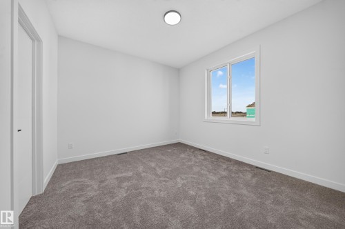 Wall-to-wall carpeting with a light gray finish - 13024 186 Avene Nw, Edmonton, AB 