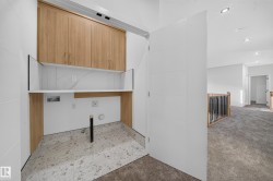 Wood-finish upper cabinetry with integrated shelving - 
