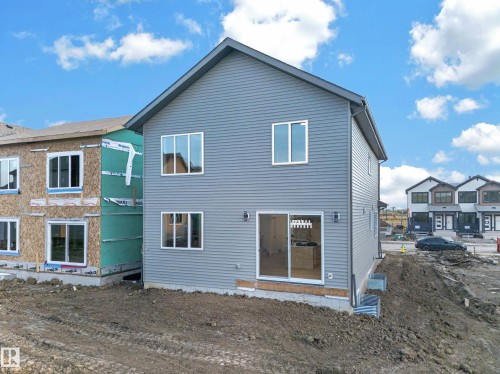 Gray siding exterior with white window frames and a gray roof - 13024 186 Avene Nw, Edmonton, AB 