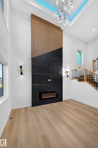Soaring ceilings with a decorative light fixture and recessed lighting - 13024 186 Avene Nw, Edmonton, AB 