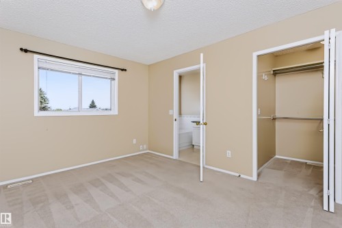 Wall-to-wall carpeting, double-pane window, and bifold closet doors - 4112 37A Avenue Nw, Edmonton, AB 
