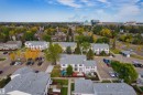 Townhouse community with multiple units, paved parking areas, and mature trees - 155 Primrose Gardens Gardens Nw, Edmonton, AB 