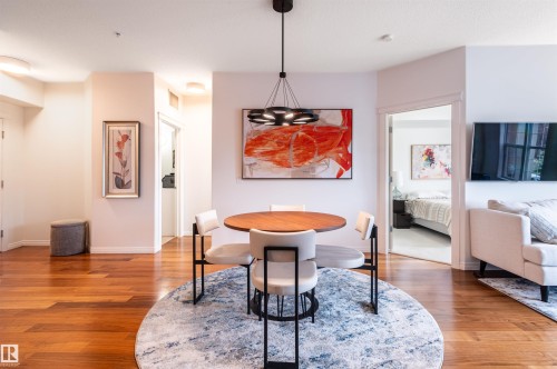 Hardwood-finish flooring, recessed lighting, and a modern chandelier - #230 45 Inglewood Dr, St. Albert, AB 