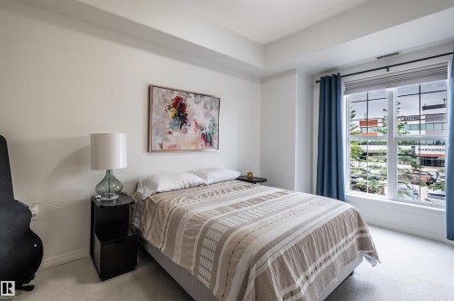 Window with multiple panes, light neutral wall color, recessed ceiling details, and neutral-toned carpeting - #230 45 Inglewood Dr, St. Albert, AB 