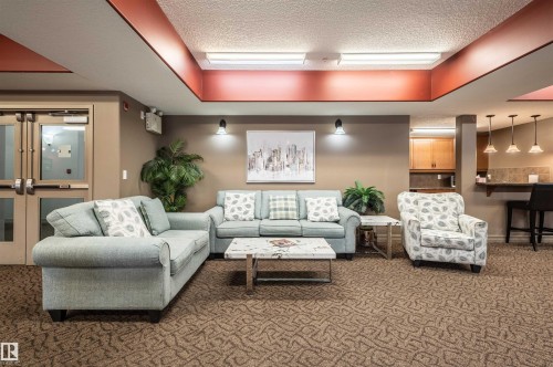 Recessed lighting, warm wall sconces, and pendant lighting illuminate the space - #230 45 Inglewood Dr, St. Albert, AB 