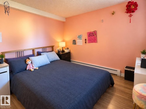 Wood-finish flooring with baseboard heating - #108 2624 Mill Woods Rd E Nw, Edmonton, AB 