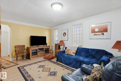 Wood-finish flooring, recessed lighting, and a textured ceiling - 9628 100A Street Nw, Edmonton, AB 