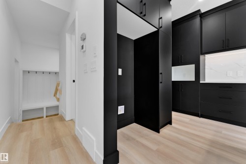Light wood-finish flooring throughout - 261 Linden Loop, Leduc, AB 