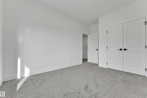 Light gray carpeted flooring, white walls, and white trim - 261 Linden Loop, Leduc, AB 