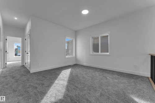 Recessed lighting, gray carpeting, white walls, and white trim - 247 Linden Loop, Leduc, AB 