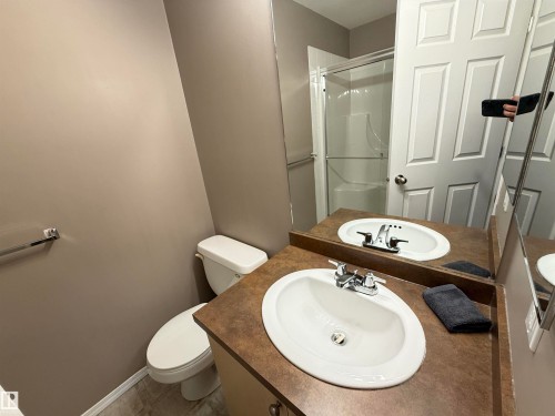 Vanity with integrated sink, chrome faucet, and expansive counter space - #302 4309 33 St, Stony Plain, AB 