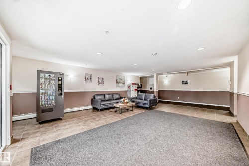 Tiled flooring, two-tone wall treatment, and recessed ceiling lighting - #302 4309 33 St, Stony Plain, AB 