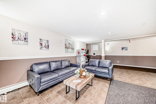 Tiled flooring throughout with two-tone wall finish and overhead lighting - #302 4309 33 St, Stony Plain, AB 