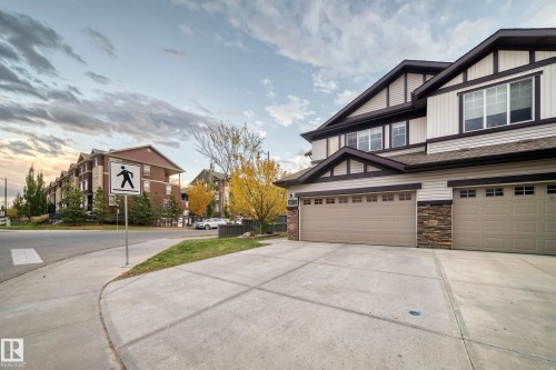Multi-story exterior with horizontal siding and decorative gables - 1673 Cunningham Way Sw, Edmonton, AB 