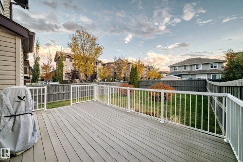Expansive outdoor deck featuring composite decking and white railings - 1673 Cunningham Way Sw, Edmonton, AB 