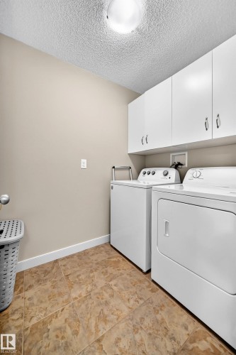 Built-in white cabinetry provides ample storage - 1673 Cunningham Way Sw, Edmonton, AB 