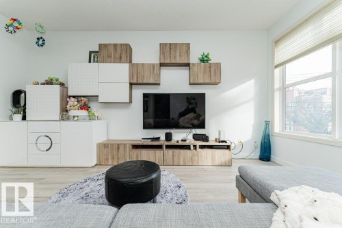 Recessed lighting and light wood-finish flooring - #202 9503 101 Av Nw, Edmonton, AB 