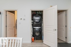 Laundry closet with stacked washer and dryer unit - 