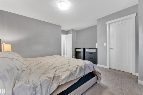 Light gray wall paint, recessed lighting, white interior door, light gray carpet flooring, white trim - #22 4205 30 St Nw, Edmonton, AB 
