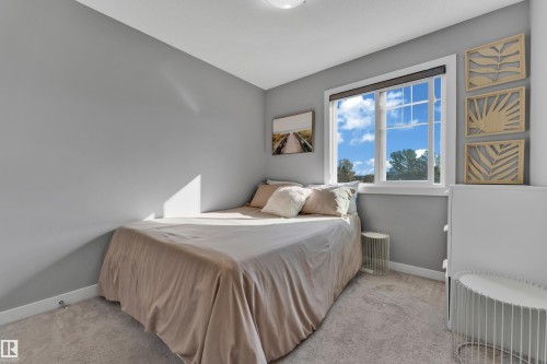 Carpeted flooring, light gray wall paint, and a white-framed window - #22 4205 30 St Nw, Edmonton, AB 