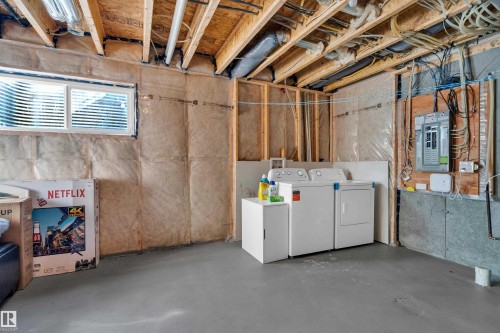 Unfinished basement with exposed ceiling joists and wall insulation - #22 4205 30 St Nw, Edmonton, AB 