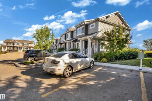 Multi-level residential structures featuring gabled roofs and horizontal siding - #22 4205 30 St Nw, Edmonton, AB 
