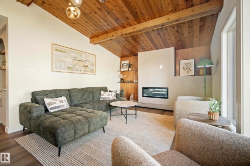 Vaulted wood-paneled ceiling with exposed beams - 10316 42 Street Nw, Edmonton, AB 