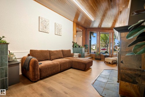 Wood-finish flooring throughout, complemented by a wood plank ceiling - 10316 42 Street Nw, Edmonton, AB 