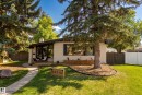 White brick exterior with prominent roofline - 10316 42 Street Nw, Edmonton, AB 