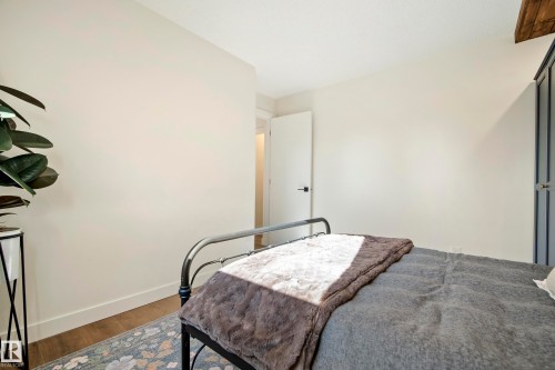 Wood-finish flooring with light-toned walls and a white ceiling - 10316 42 Street Nw, Edmonton, AB 