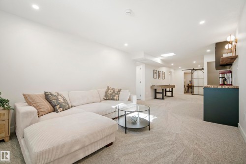 Recessed lighting illuminates the carpeted floor - 10316 42 Street Nw, Edmonton, AB 
