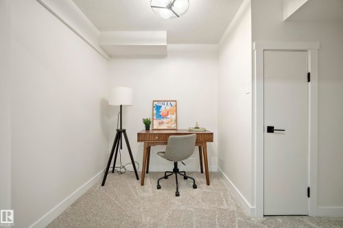 Recessed ceiling elements, textured carpet flooring, and a contemporary flush mount ceiling light - 10316 42 Street Nw, Edmonton, AB 