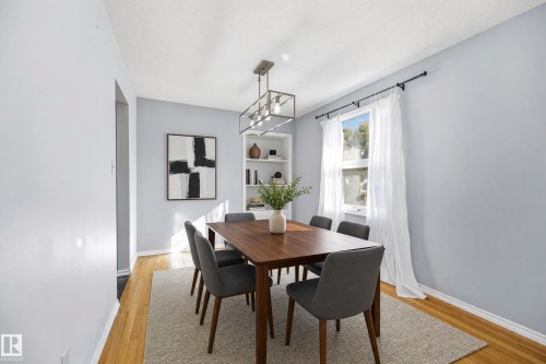 Built-in shelving, wood-finish flooring, and a rectangular window - 74 Aspen Crescent, St. Albert, AB 