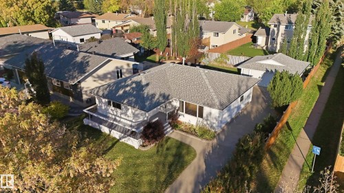 Single-story residence featuring a gabled roof, a front-facing deck, and a paved driveway - 74 Aspen Crescent, St. Albert, AB 